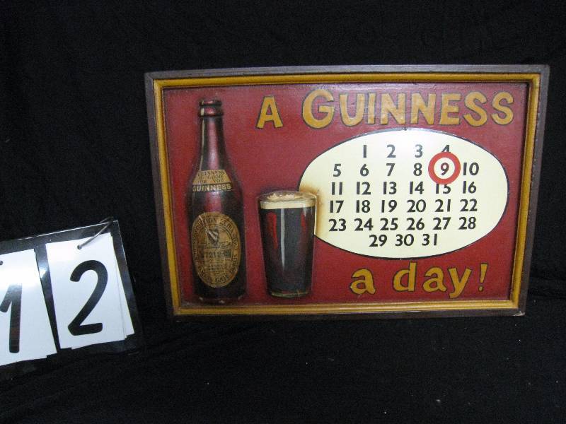 lot 12 image: Guinness a Day calendar with moveable magnetic ring, very cool 3D