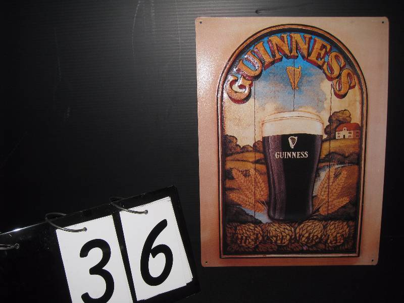 lot 36 image: Guinness tin tacker, NOS New Old Stock