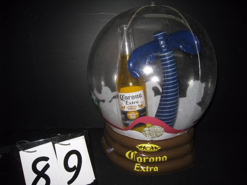 lot 89 image: Corona inflatable snow globe