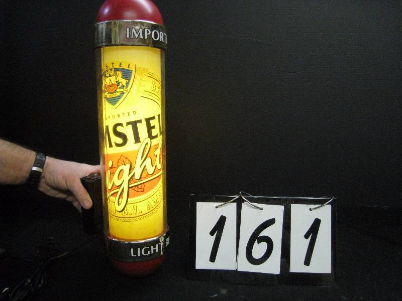 lot 161 image: Amstel Light barber pole - internally lit, center graphic rotates, hangs on wall, RARE and very cool, works great