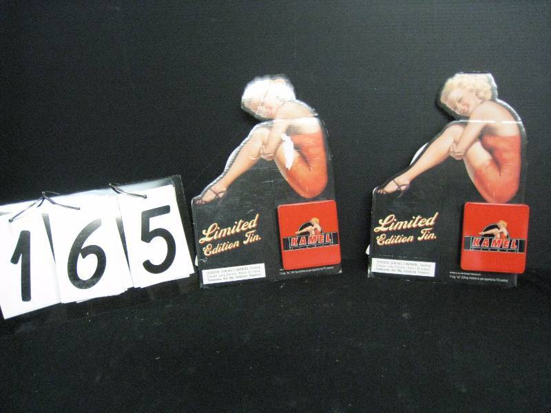 lot 165 image: Kamel Limited Edition tins (2) - tins are 3.25 x 3.5, 1 cardboard display has small tear in graphic