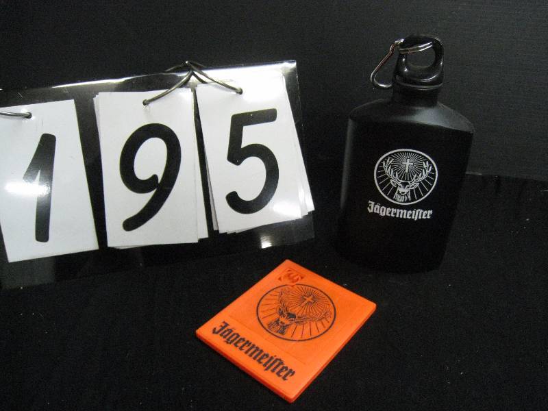 lot 195 image: Jagermeister aluminum flask and plastic slide puzzle