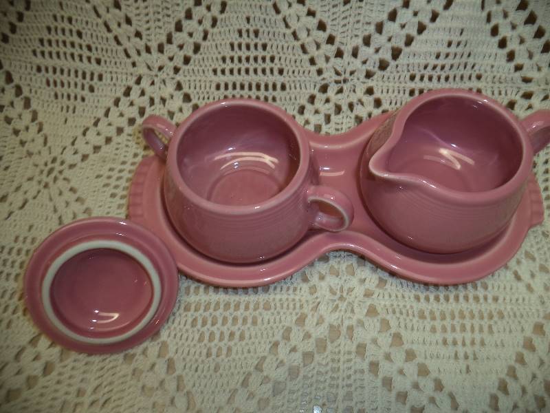 lot 33 image: Fiesta CreamerSugar Set