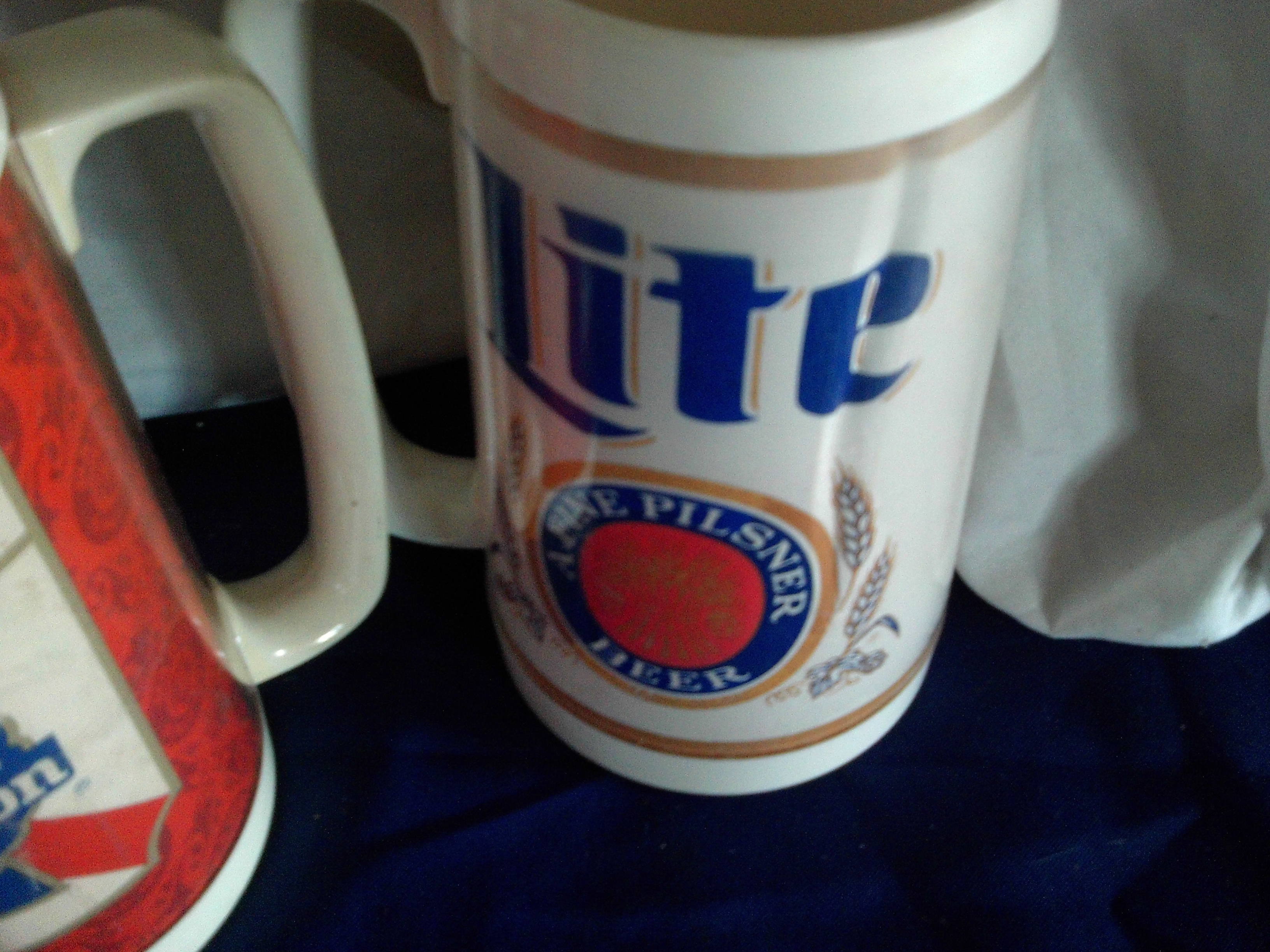 2 vintage insulated beer mugs