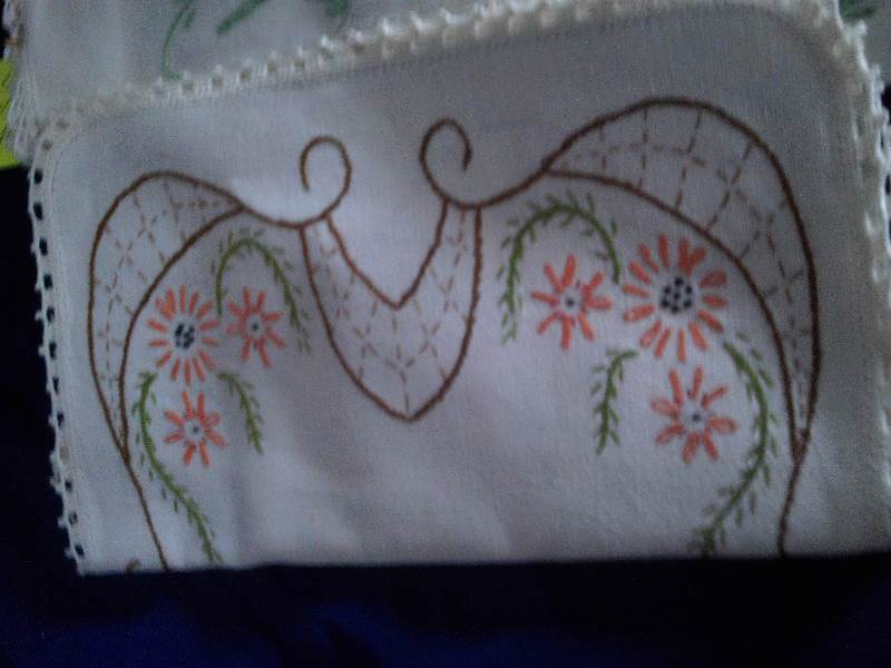 embroidered arm and head cover for a chair