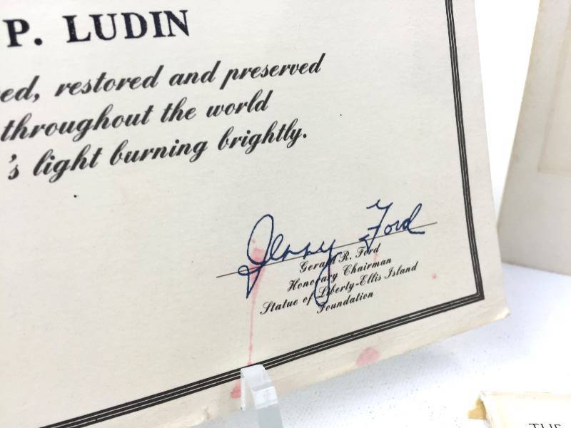 Signed letter by President Ford and a White house Ronald Reagan Christmas card.