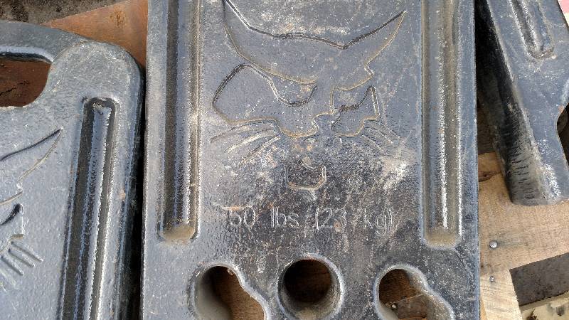 (8) Bobcat 50 lb. Weights...