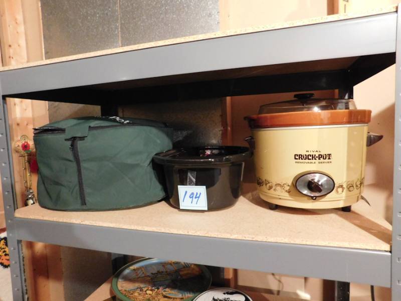 lot 194 image: two crock pots one with carry case and it has two inserts one is divided