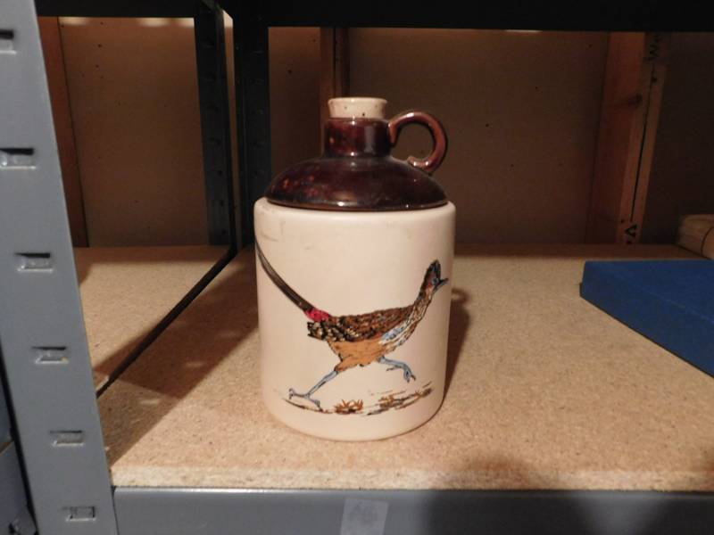 lot 197 image: unsigned roadrunner cookie jar shaped like a whiskey jug
