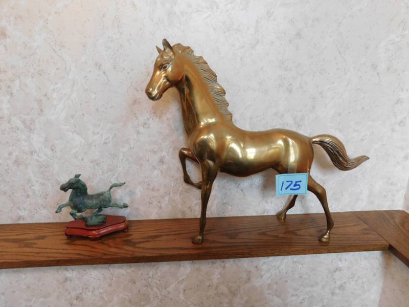 lot 175 image: two metal horse statues one is brass the other greenish metal