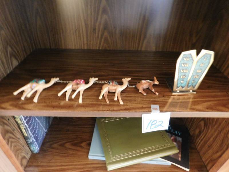 lot 182 image: Jerusalem collectibles a camel train and a pair of bookends