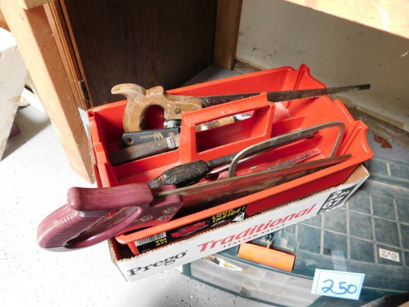 lot 243 image: tool box with several saws and some misc hardware