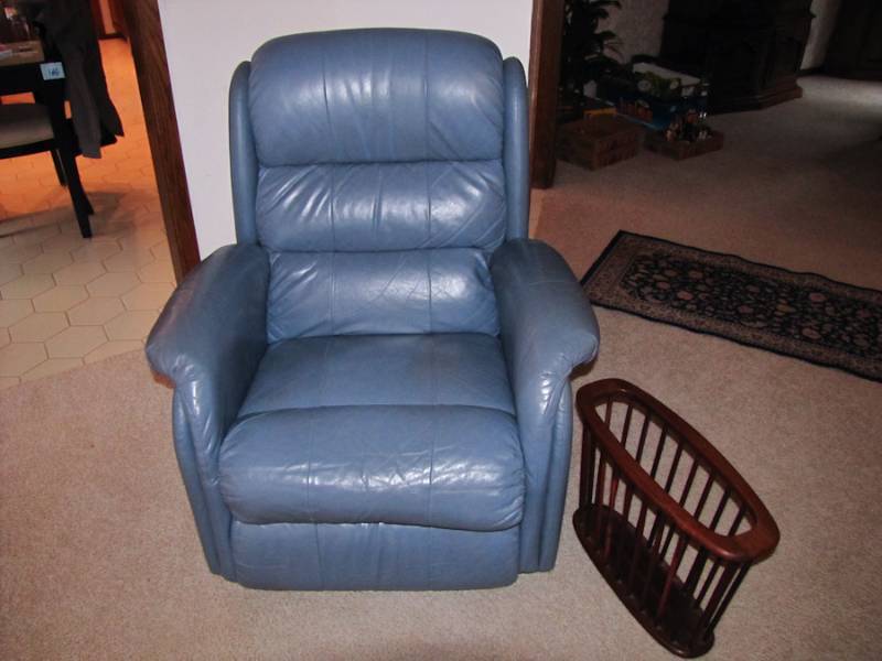 lot 13 image: Leather recliner chair & magazine rack