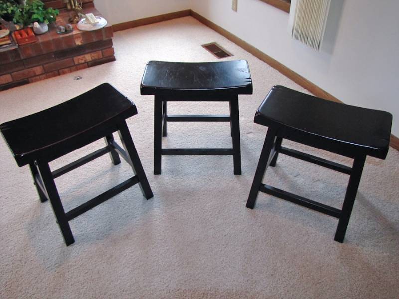 lot 165 image: three dark saddle stools all one price