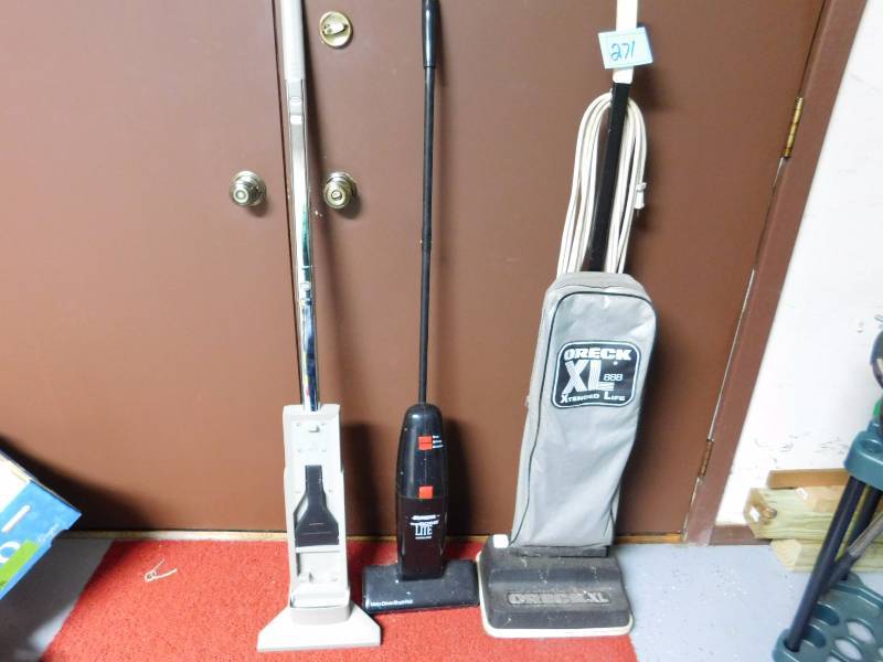 lot 271 image: oreck XL vacuum and a stick broom