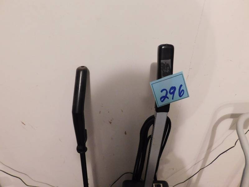 lot 296 image: oreck commercial vacuum and stick vacuum