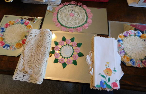 lot 362 image: four mirrors and several doilies please see photos