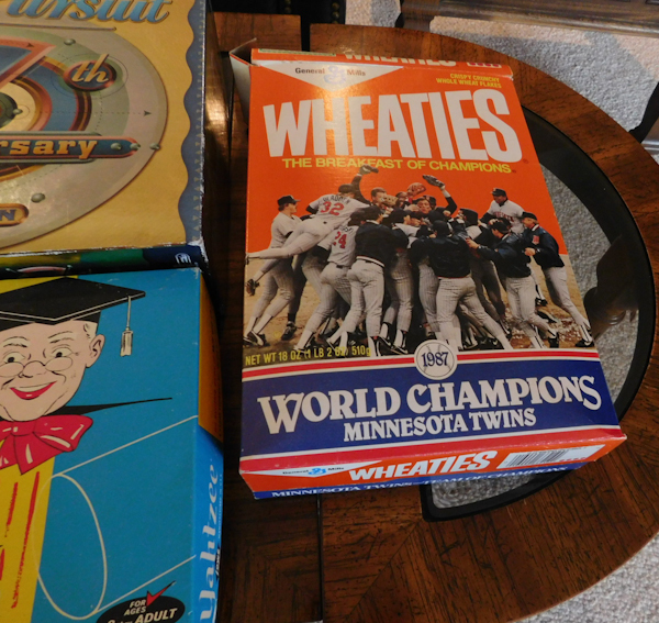 lot 404 image: Twins Wheaties box, Newspaper articles Yahtzee Trivial pursuit
