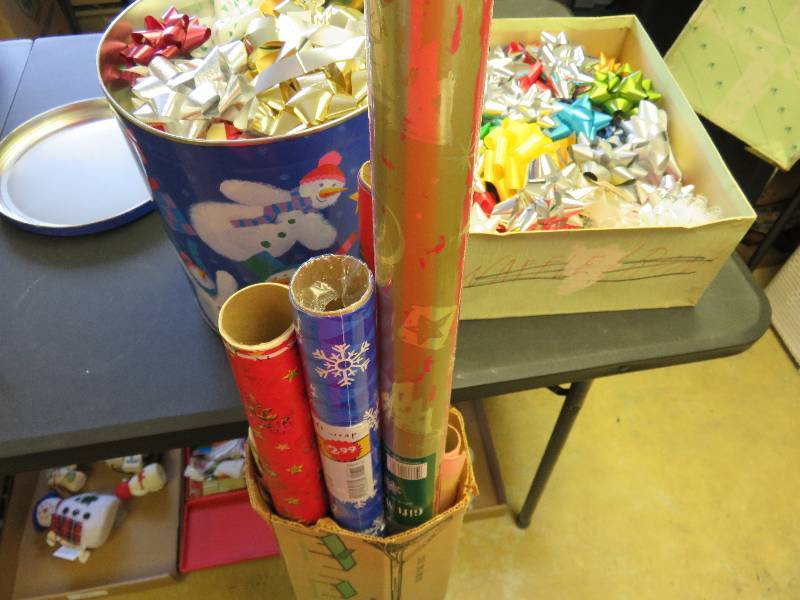 wrapping paper, snowman tin, ribbons