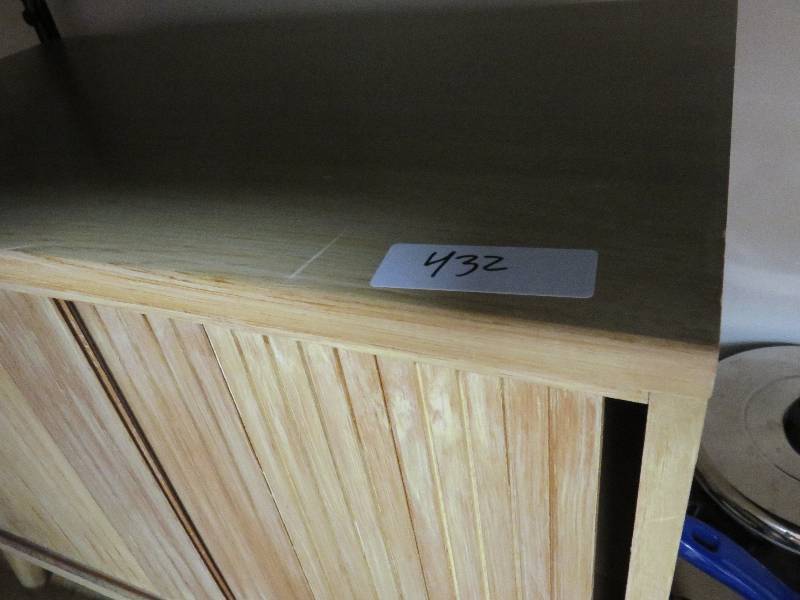 Side table with sliding doors