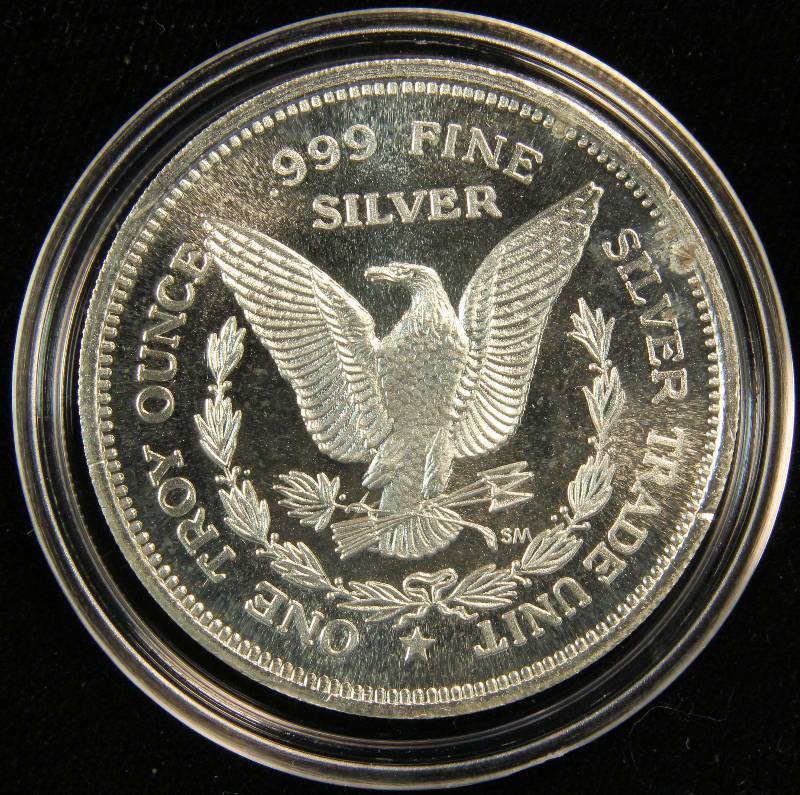 VINTAGE 1 TROY OZ. .999 FINE SILVER 1985 MORGAN DOLLAR DESIGN SILVER TRADE UNIT IN AIRTITE HOLDER