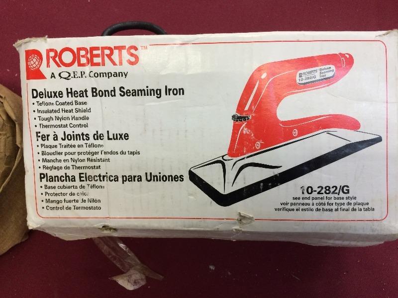 Carpet Seaming Iron and a roll of seaming materials