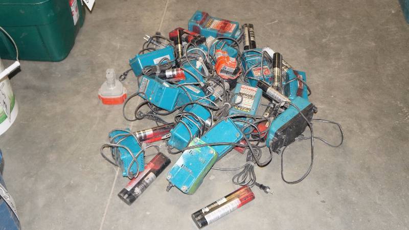 Bucket of Makita Batteries and Battery Chargers