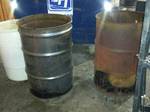 Lot of 2 Wood Burning Barrels & 1 Plastic Barrel