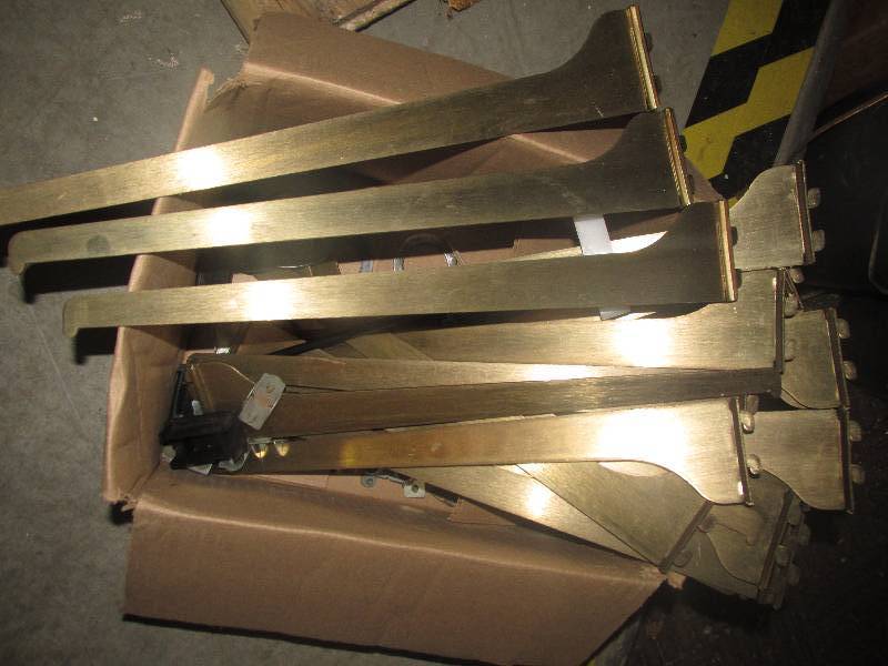 box of gold colored shelf holder ho...