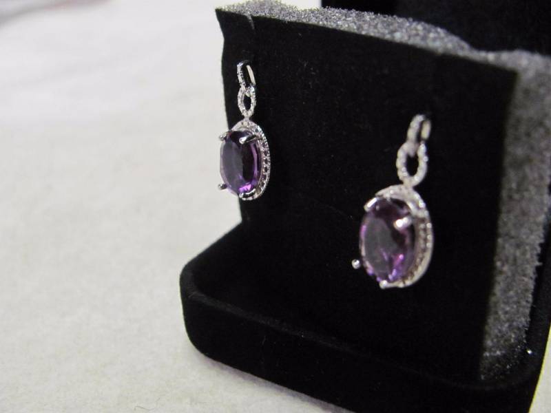 lot 104 image: Sterling Sliver Amethyst Oval Earrings