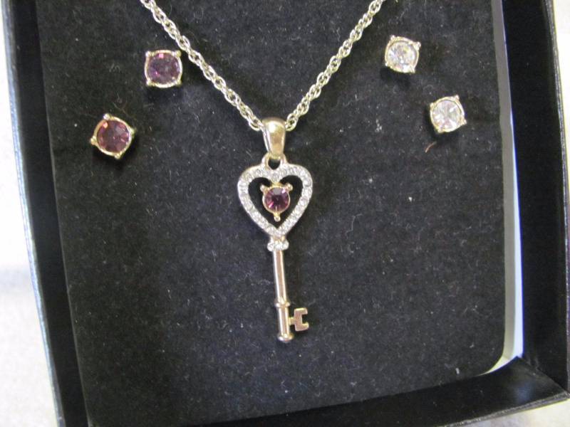 lot 110 image: Goldtone Key February Birthstone Pendent & Earring Set