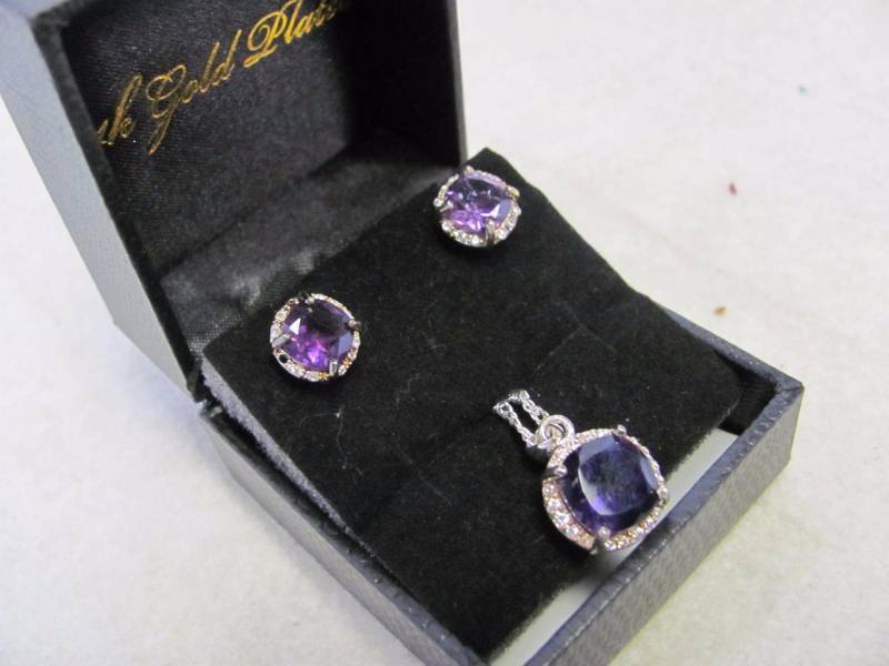 lot 114 image: 14 Karat Gold Plated Amethyst Round Earrings & Pendant Set