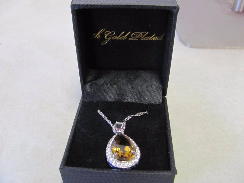 lot 124 image: 14 Karat Gold Plated Amber Brown Teardrop Pendant