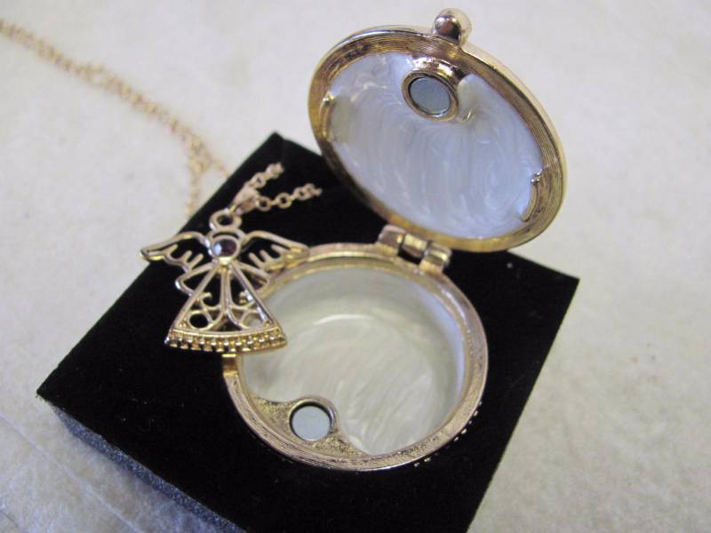 lot 130 image: February Birthstone Angel Necklace & Locket Set
