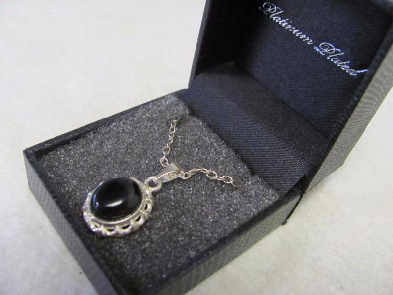 lot 135 image: Platinum Plated Black Onyx Oval Pendant