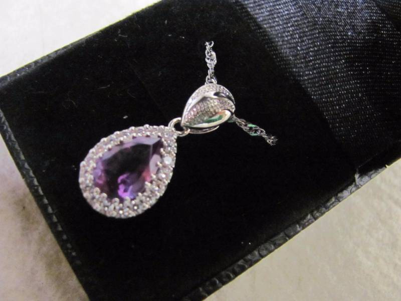lot 144 image: Stunning Platinum Plated Amethyst and Crystal Gem Tear Drop Pendant