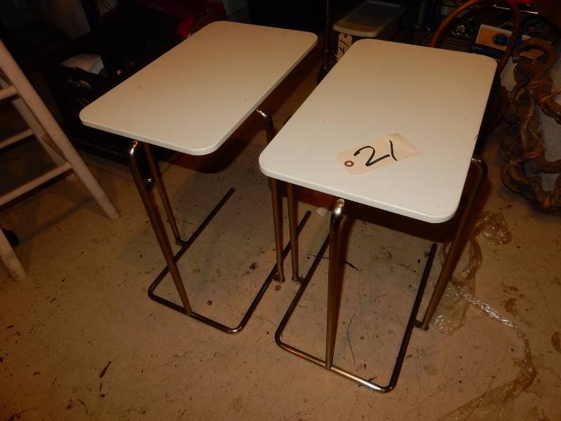 lot 21 image: 2 nice side tables.. Chrome legs and heavy plastic tops. 20in x 12in x 22in h.