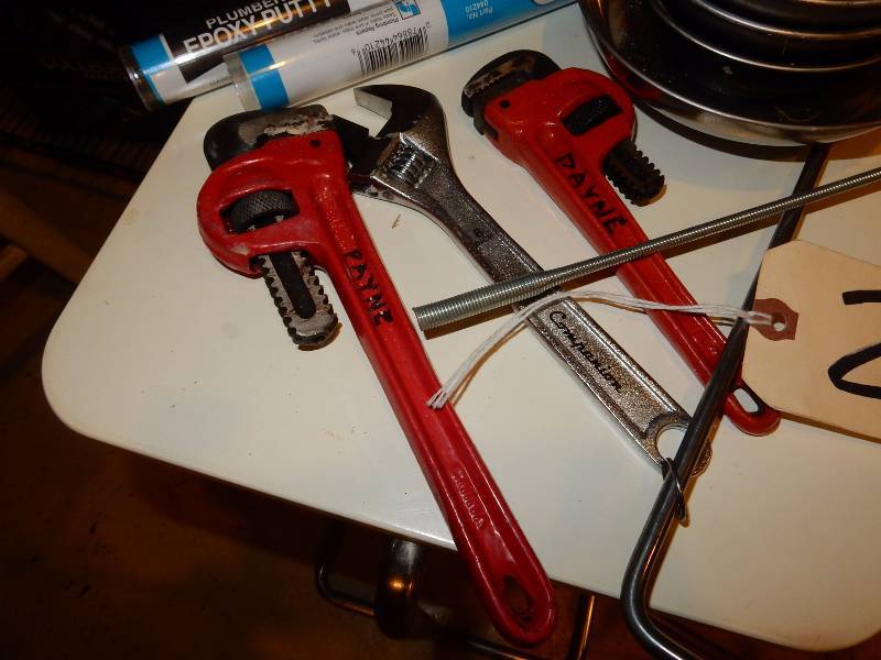 lot 25 image: Misc. Plumping and drain Cleaning items.. 3 smaller pipe wrenches.. Magnetized bowls, roll of plastic tape.. See closeups