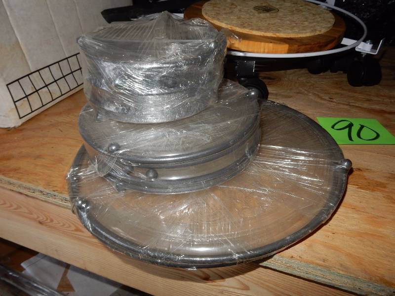 lot 90 image: 3 Rolling round carts.. Possibly for a planter.  Misc. Plastic trivetts.. Probably to set plants on to protect surfaces