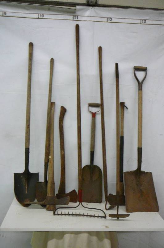 Lot of Yard tools - Hoes - Axes - Shovels - Rocks - etc.