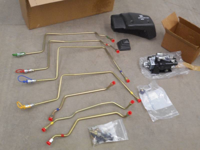 lot 9 image: Unused TractorLoader Control Set ...