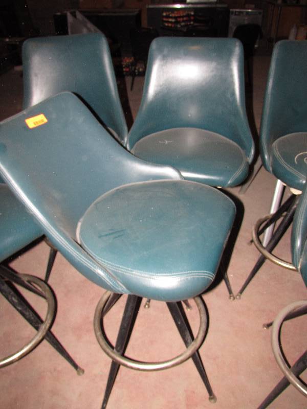 Set of 2 swivel vinyl upholstered wback bar stools (1 wlose back and 1 wsm tear)