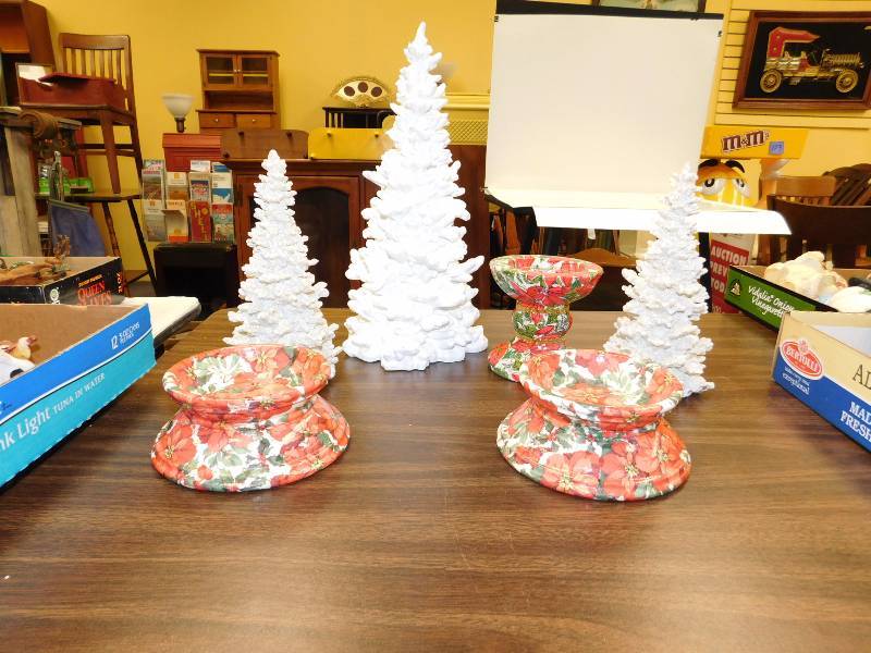 lot 28 image: three candle holders and three white Christmas trees