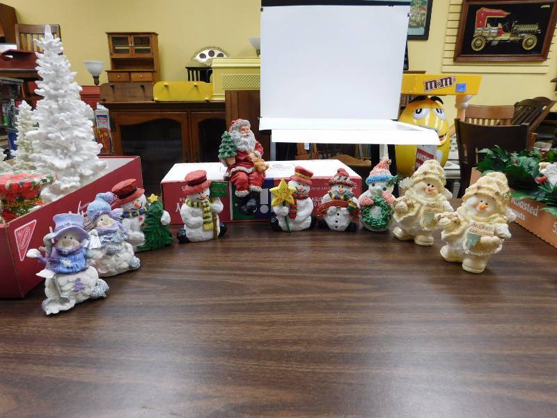 lot 29 image: snowmen and a sitting Santa figurines