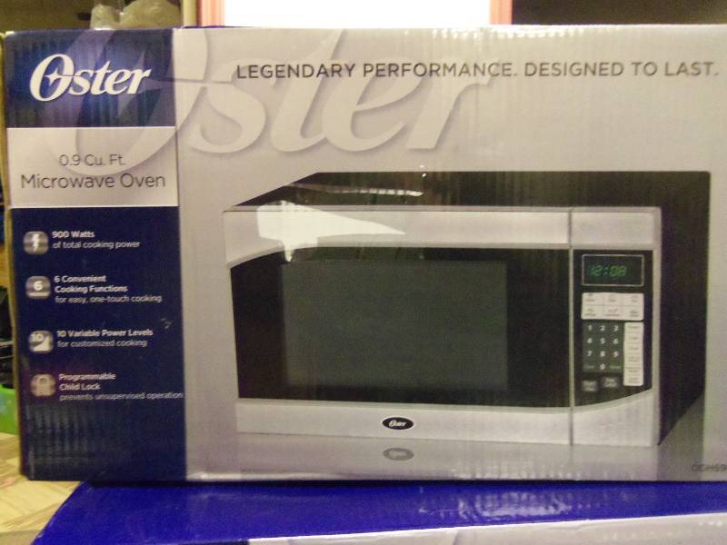 lot 50 image: 0.9 Cubic Foot Oster Microwave