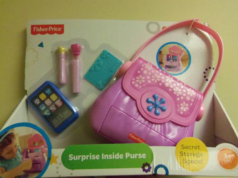 lot 56 image: Fisher Price Surprise Inside Purse