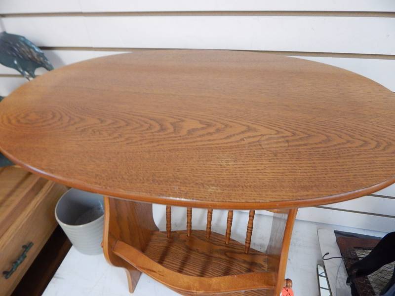 Small oval lamp table with magazine rack base