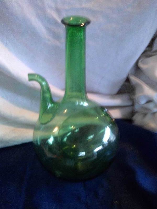 vintage green bottle with spout