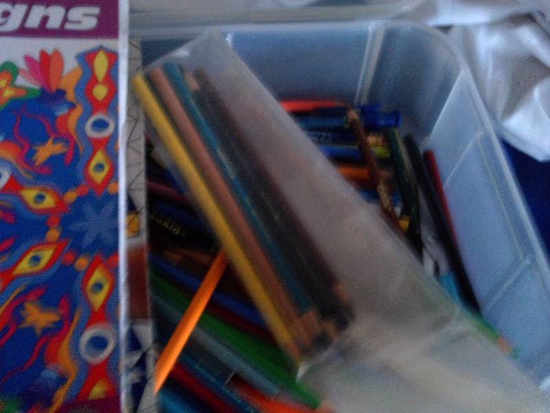 box of prism designs and pencils