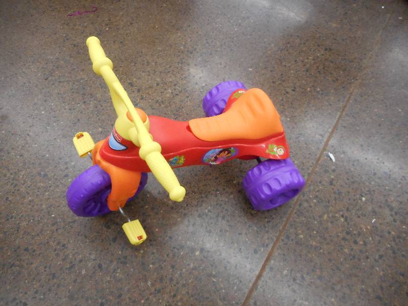 lot 74 image: Fisher-Price Dora Tough Trike Ride-On